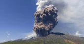 Sicily's Mount Etna erupts with columns of smoke and ash