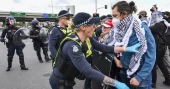 Anti-war protesters in Australia clash with police outside a weapons convention