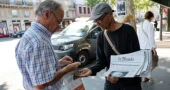France's last newspaper hawker to receive national honour  from President Macron 