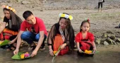Biju, Bishu festivals begin in Bandarban with flower offerings in river