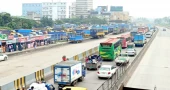 Dhaka-Ctg highway sees long tailback as workers block road demanding dues
