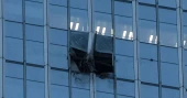 Pilot killed, 13 injured after small plane crashes into Beijing high-rise