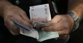 Iran’s currency hits record low as war weighs on economy
