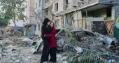 Russian attack on Ukraine kills at least 18 and traps others in damaged buildings