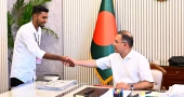 Long-held wish comes true as July uprising survivor presents blood-stained flag to PM