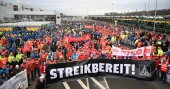 Volkswagen workers strike for two hours against pay cuts, closures