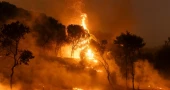 18 bodies found in Greece as firefighters battle wind-driven wildfires across the country
