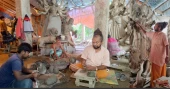 Narayanganj artisans passing busy time making idols for Durga Puja