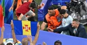 Cristiano Ronaldo just avoided being hit by a fan who jumped from the crowd to get to him at Euros