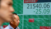  Asian markets mixed, pausing ahead of Fed chief testimony