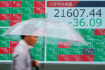 Asian shares mostly higher after Wall St sets new records
