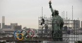 Olympic rings arrive in host city on barge into Tokyo Bay