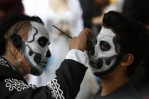 Mexicans parade as fancy skeletons ahead of Day of the Dead