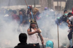 Ecuador clash site has party clowns, recycling, tear gas