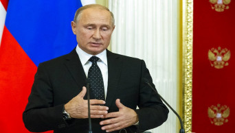 Putin seeks to defuse downing of Russian plane off Syria