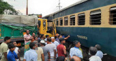 Train hits truck stranded on tracks in Pabna