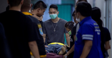 Families of Thai shooting victims wait for answers, bodies