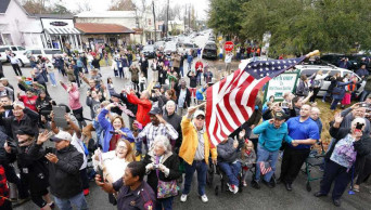 Flag-waving crowds in Texas watch Bush's funeral train