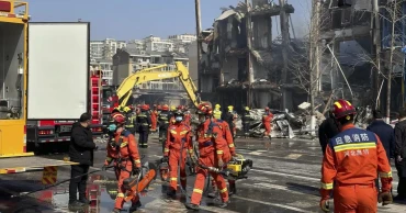 An explosion in a building outside Beijing kills 2 people and injures 26