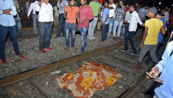 Train mows down crowd at India festival, at least 60 dead