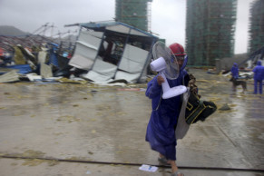 At least 13 dead in typhoon, 16 missing