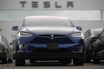 Tesla's stock soars after company posts surprising 3Q profit