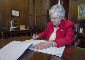 Alabama governor signs near-total abortion ban into law