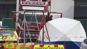 39 people found dead in truck container in southeast England
