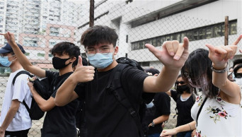 Hong Kong hears first case on mask ban violation