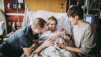 Grandmother gives birth as surrogate for her son and his husband