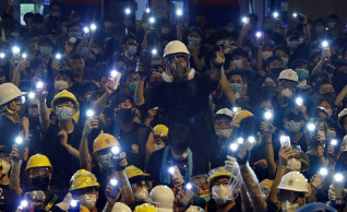 Hong Kong protesters disperse after blocking police HQ