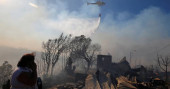 Helicopters in Chile douse fire that destroyed 200 homes