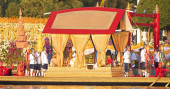 Thai king takes part in royal barge procession in Bangkok