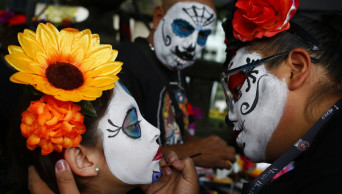 Mexicans parade as fancy skeletons ahead of Day of the Dead