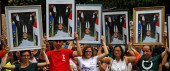 Climate activists nab Macron portraits, divide French judges