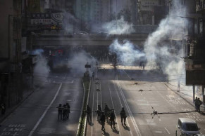 Tear gas clouds downtown Hong Kong as protesters defy ban