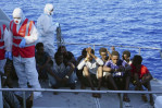 Migrants jump off rescue boat to try to reach Italian island