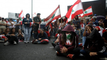 Lebanese president vows reforms as protests engulf country