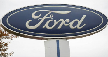 Ford full-year profit plunges on slower sales, pension costs