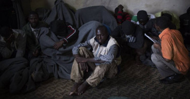 TB, armed guards, lack of food at UN migrant center in Libya