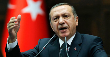 Turkish president says will not bear burden of refugees alone