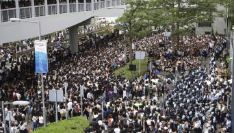 100s of protesters surround Hong Kong HQ before bill debate