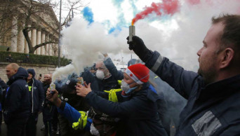 France suspends fuel tax, utility hikes amid protests