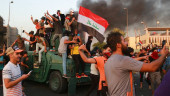 Iraqi PM addresses the nation, urges protesters to go home