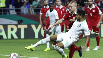 Iran and Iraq advance at Asian Cup, Saudis on verge