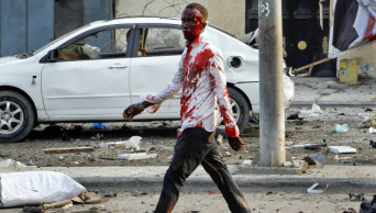 4 car bombs explode by hotel in Somalia's capital; 20 dead